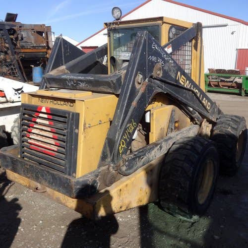 Used New Holland L785 Skid Steer Loader parts.