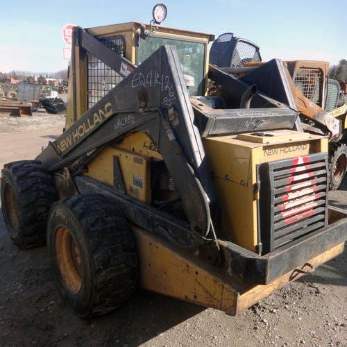 Used New Holland L785 Skid Steer Loader parts.