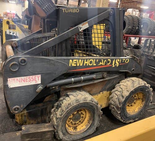 Used New Holland LS170 Skid Steer Loader parts.