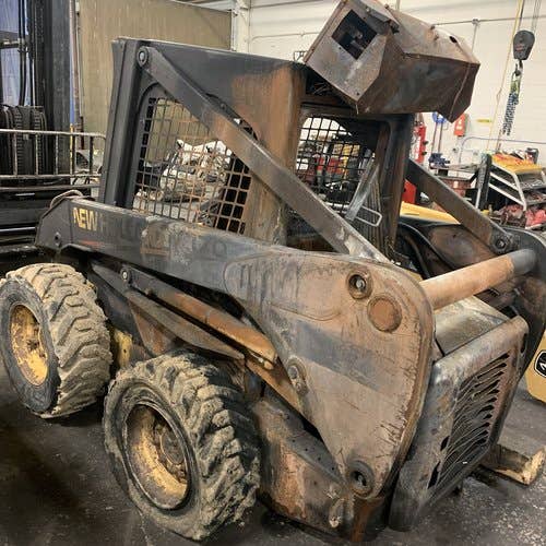 Used New Holland LS170 Skid Steer Loader parts.