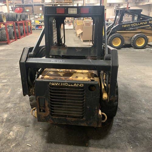 Used New Holland LX485 Skid Steer Loader parts.
