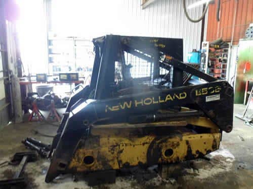 Used New Holland LX565 Skid Steer Loader parts.
