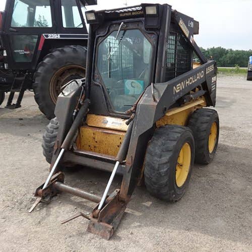 Used New Holland LX565 Skid Steer Loader parts.
