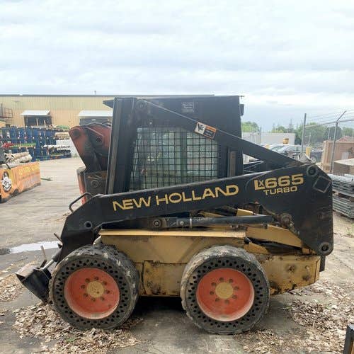 Used New Holland LX665 Skid Steer Loader parts.