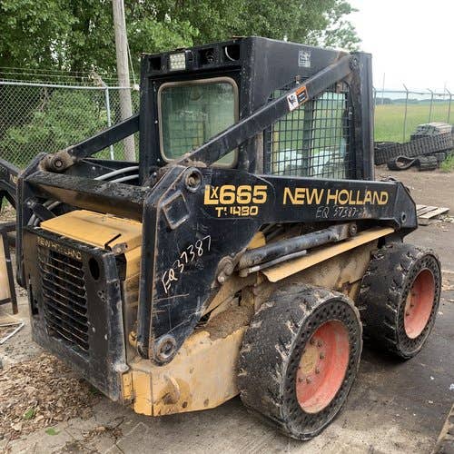 Used New Holland LX665 Skid Steer Loader parts.