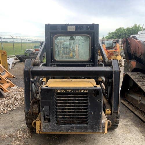 Used New Holland LX665 Skid Steer Loader parts.